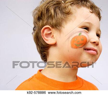 Three year old boy with face paint of a pumpkin View Large Photo Image Stock Photograph - Three year old boy with face paint of a pumpkin. Fotosearch