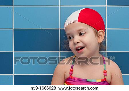 Stock Photo - Three year old girl at swimming pool ready for a swimming lesson. Fotosearch