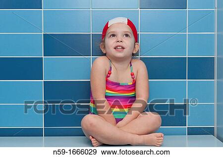 Three year old girl at swimming pool ready for a swimming lesson View Large Photo Image Stock Photo - Three year old girl at swimming pool ready for a swimming lesson. Fotosearch