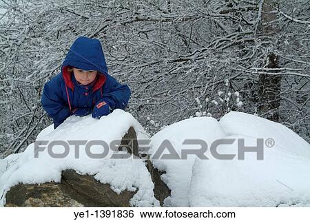 Three year old girl climbing on snowy rocks, Selonnet, French Alps, France View Large Photo Image Stock Photograph - Three year old girl climbing on snowy rocks, Selonnet, French Alps, France. Fotosearch