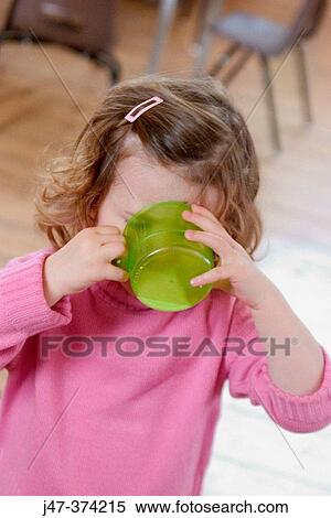 Three year old girl drinking milk View Large Photo Image Stock Photography - Three year old girl drinking milk. Fotosearch