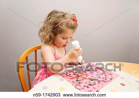 Three year old girl painting a dot picture View Large Photo Image Stock Image - Three year old girl painting a dot picture. Fotosearch