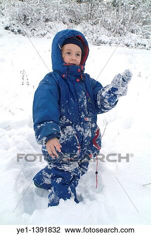 Three year old girl playing in the snow at a ski resort in the French Alps, France View Large Photo Image Stock Image - Three year old girl playing in the snow at a ski resort in the French Alps, France. Fotosearch