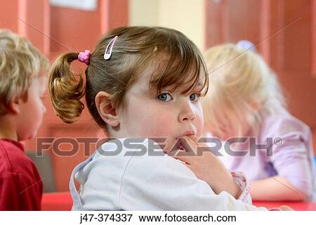Three year old girl turning round, looking over her shoulder, sucking two fingers View Large Photo Image Stock Photo - Three year old girl turning round, looking over her shoulder, sucking two fingers. Fotosearch