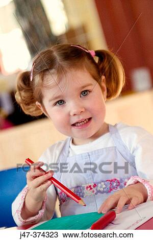 Three year old girl with bunches, drawing at nursrey school View Large Photo Image Stock Image - Three year old girl with bunches, drawing at nursrey school. Fotosearch