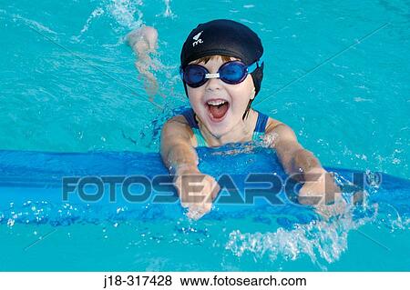 Three years old girl swimming in backyard pool View Large Photo Image Stock Photo - Three years old girl swimming in backyard pool. Fotosearch