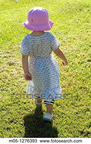 Three years old toddler playing in the park View Large Photo Image Stock Image - Three years old toddler playing in the park. Fotosearch