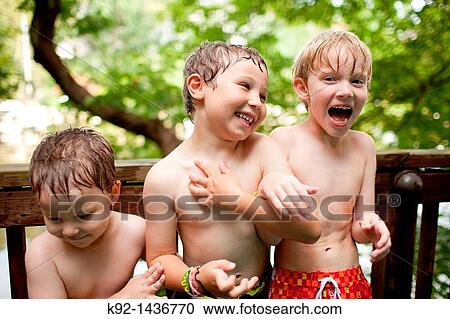 Three young boys laughing. View Large Photo Image Stock Image - Three young boys laughing.. Fotosearch