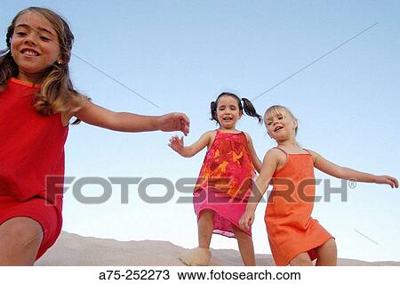 Stock Image - three young friends. Fotosearch