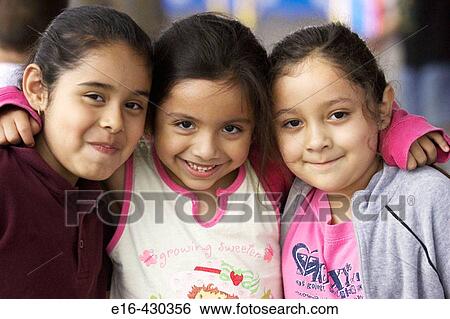Three young Hispanic friends View Large Photo Image Stock Photograph - Three young Hispanic friends. Fotosearch