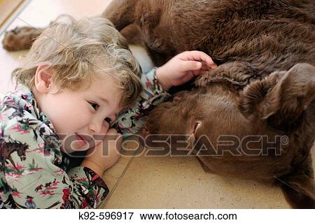 Stock Photo - Three_year_old boy and dog. Fotosearch