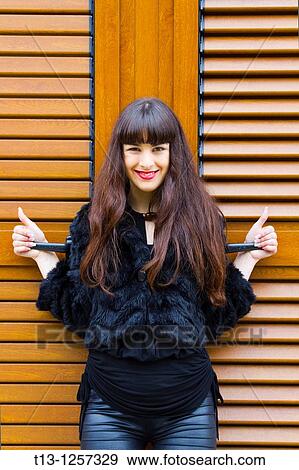 Stock Photo - Thumbs up young woman. Fotosearch