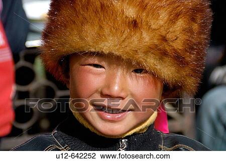 Stock Image - Tibetan boy. Festival. Danba. Sichuan. Fotosearch