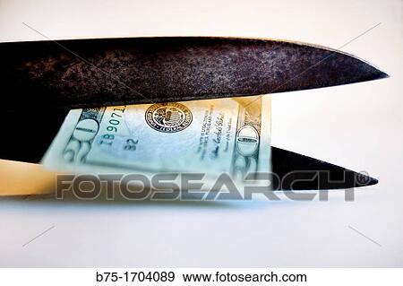 tijeras cortando un billete de 20 dolares, recortes economicos, scissors cutting a 20 dollars bill, economic cutbacks, View Large Photo Image Stock Photo - tijeras cortando un billete de 20 dolares, recortes economicos, scissors cutting a 20 dollars bill, economic cutbacks,. Fotosearch