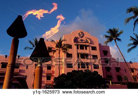 Stock Image - Tiki torch, Royal Hawaiian Hotel, Waikiki, Oahu, Hawaii, USA. Fotosearch