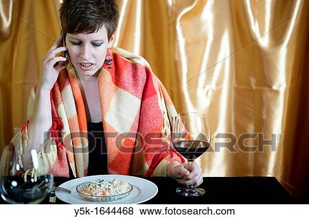 Tilburg, Netherlands. Disappointed young woman is waiting for her dinerdate at a romantic diner-table. View Large Photo Image Stock Photo - Tilburg, Netherlands. Disappointed young woman is waiting for her dinerdate at a romantic diner-table.. Fotosearch