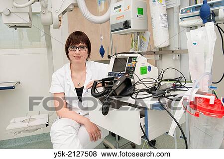 Stock Photo - Tilburg, Netherlands. Mrs. Linda van I. working as para medic, specialized in trauma care and responsible for cardiac functions and reanimation.. Fotosearch