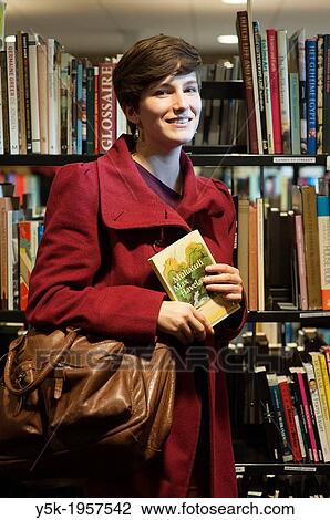 Tilburg, Netherlands. Portrait of a young brunette Philosophy student at Tilburg University, just buying a book at a second hand book store. View Large Photo Image Stock Image - Tilburg, Netherlands. Portrait of a young brunette Philosophy student at Tilburg University, just buying a book at a second hand book store.. Fotosearch