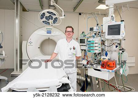 Tilburg, Netherlands. Portrait of the para medics team leader, Mr. Twan V., in his working environment: the first aid's trauma room. View Large Photo Image Stock Image - Tilburg, Netherlands. Portrait of the para medics team leader, Mr. Twan V., in his working environment: the first aid's trauma room.. Fotosearch