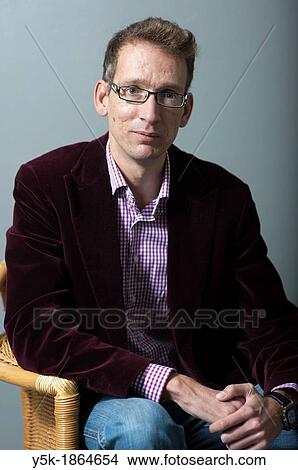 Tilburg, Netherlands. Studio-portrait of a long man with glasses. View Large Photo Image Picture - Tilburg, Netherlands. Studio-portrait of a long man with glasses.. Fotosearch