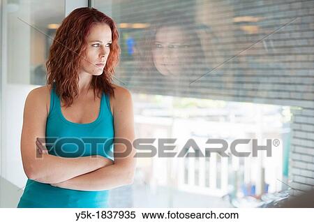 Tilburg, Netherlands. Young woman having a break during her workout in the gym. View Large Photo Image Stock Photography - Tilburg, Netherlands. Young woman having a break during her workout in the gym.. Fotosearch