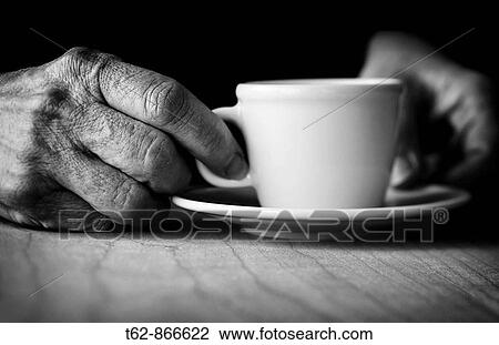 Time for coffee Hands of elderly woman holding a cup View Large Photo Image Stock Image - Time for coffee Hands of elderly woman holding a cup. Fotosearch