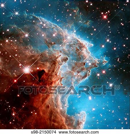 Picture - To celebrate its 24th year in orbit, the NASA/ESA Hubble Space Telescope has released this beautiful new image of part of NGC 2174, also known as the Monkey Head Nebula.. Fotosearch
