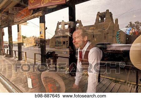 Toas, New Mexico, owner of western themed store and refletions of street View Large Photo Image Stock Photography - Toas, New Mexico, owner of western themed store and refletions of street. Fotosearch