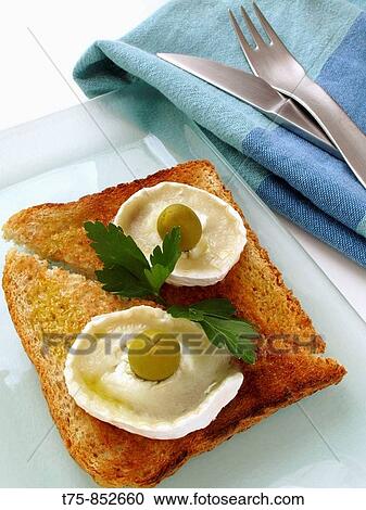 Toast with goat cheese and olives View Large Photo Image Stock Image - Toast with goat cheese and olives. Fotosearch