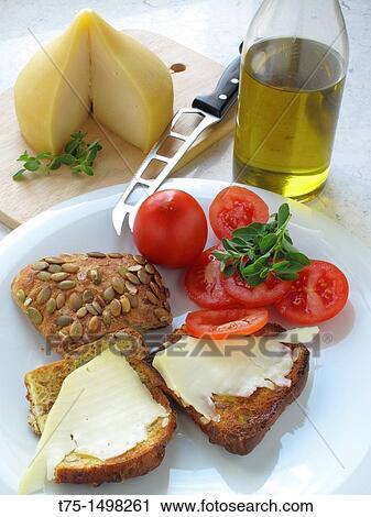 Toast with olive oil, cheese, tomato and oregano View Large Photo Image Stock Image - Toast with olive oil, cheese, tomato and oregano. Fotosearch