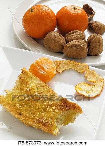 Toasted bread with olive oil, walnuts and mandarin View Large Photo Image Stock Image - Toasted bread with olive oil, walnuts and mandarin. Fotosearch