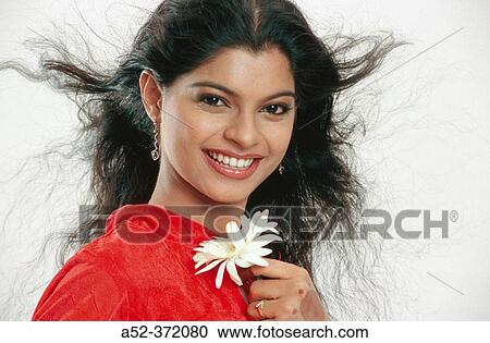 Stock Image - Todays Indian girl with flying hair.. Fotosearch