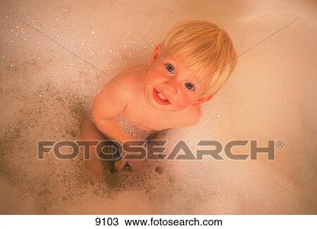 Toddle boy takes bubble bath View Large Photo Image Stock Image - Toddle boy takes bubble bath. Fotosearch