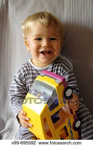 Toddle with toy truck View Large Photo Image Stock Image - Toddle with toy truck. Fotosearch