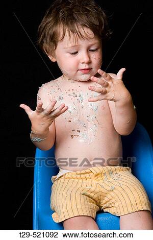 Toddler after eating a messy meal View Large Photo Image Stock Image - Toddler after eating a messy meal. Fotosearch