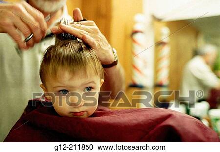 Toddler boy getting hair cut. Boise. Idaho. USA View Large Photo Image Stock Image - Toddler boy getting hair cut. Boise. Idaho. USA. Fotosearch