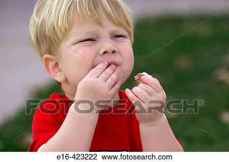 Toddler eating cookie View Large Photo Image Stock Image - Toddler eating cookie. Fotosearch
