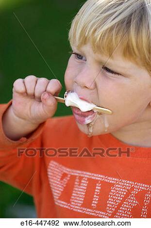toddler eating ice cream View Large Photo Image Stock Image - toddler eating ice cream. Fotosearch