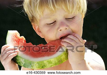 Toddler eating watermelon View Large Photo Image Stock Photo - Toddler eating watermelon. Fotosearch