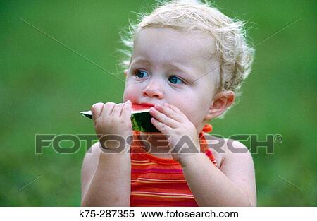 toddler eating watermelon View Large Photo Image Stock Photography - toddler eating watermelon. Fotosearch