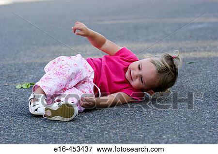 toddler fallen on street View Large Photo Image Stock Photo - toddler fallen on street. Fotosearch