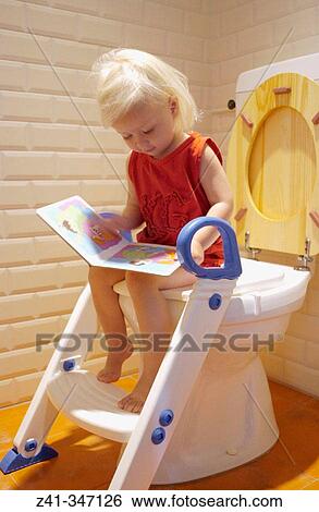 Toddler girl in the bathroom View Large Photo Image Stock Photograph - Toddler girl in the bathroom. Fotosearch
