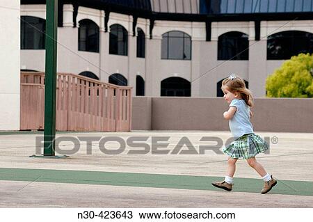 Toddler girl running View Large Photo Image Stock Image - Toddler girl running. Fotosearch