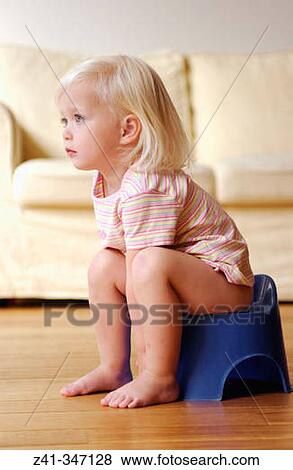 Toddler girl using potty View Large Photo Image Stock Photo - Toddler girl using potty. Fotosearch