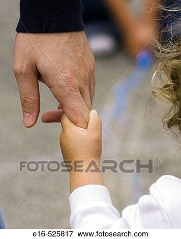 Toddler holding father's hand View Large Photo Image Stock Photo - Toddler holding father's hand. Fotosearch