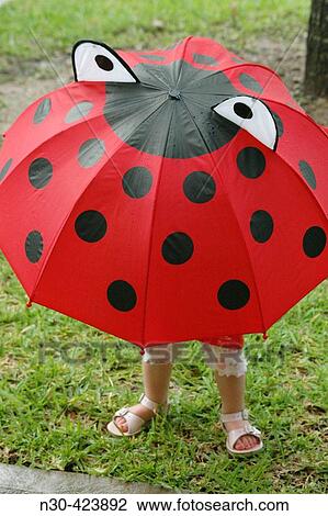 Toddler holding Ladybug Umbrella View Large Photo Image Stock Image - Toddler holding Ladybug Umbrella. Fotosearch