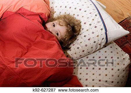 Stock Photo - Toddler in bed. Fotosearch