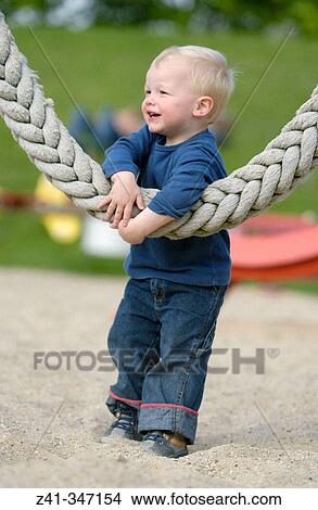 Picture - Toddler in playground. Fotosearch