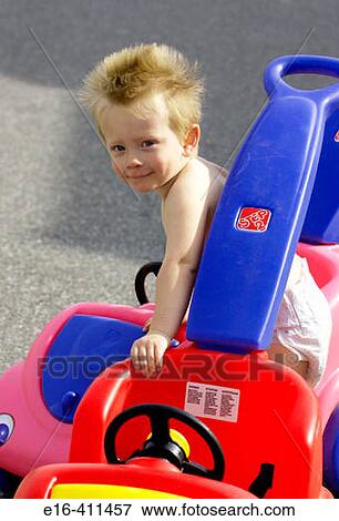 toddler in toy car View Large Photo Image Stock Photo - toddler in toy car. Fotosearch