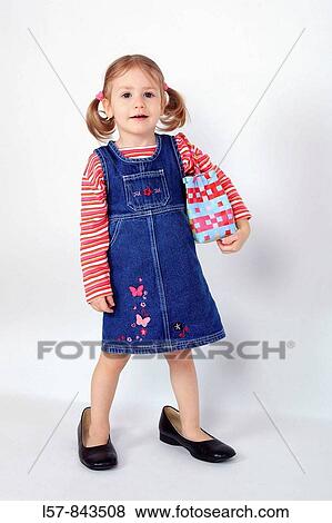 toddler, little girl, wearing dress and grown up dress shoes, standing with handbag over shoulder, piggy tail hairstyle, white background, studio, Switzerland View Large Photo Image Stock Photo - toddler, little girl, wearing dress and grown up dress shoes, standing with handbag over shoulder, piggy tail hairstyle, white background, studio, Switzerland. Fotosearch